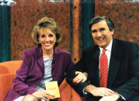 photo of Gervase Phinn with Esther Rantzen in TV studio linking arms