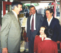 photograph showing Gervase with 2 school children and 2 adults