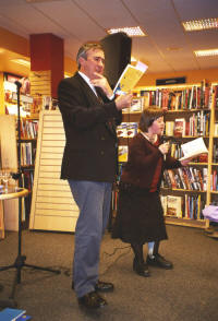 Gervase Phinn and Beth performing a  poem by Gervase in bookshop